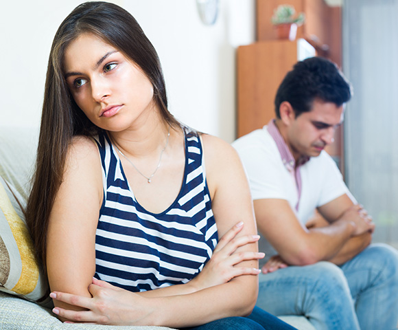 woman looking upset sitting beside man looking away both in a tense situation suggesting relationship struggles 5 ways to improve communication