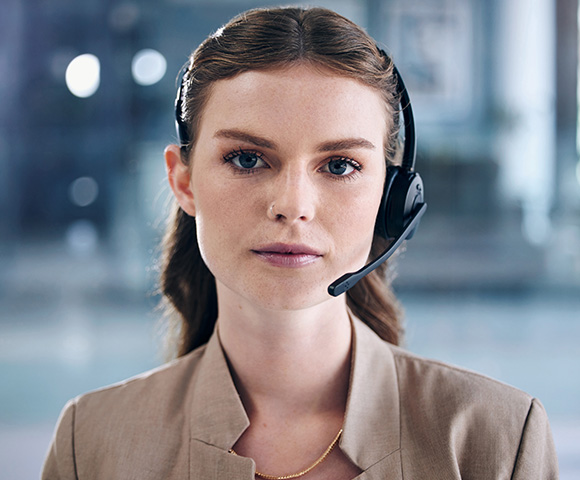 female customer service representative with headset in a professional setting confident expression communication skills five effective solutions